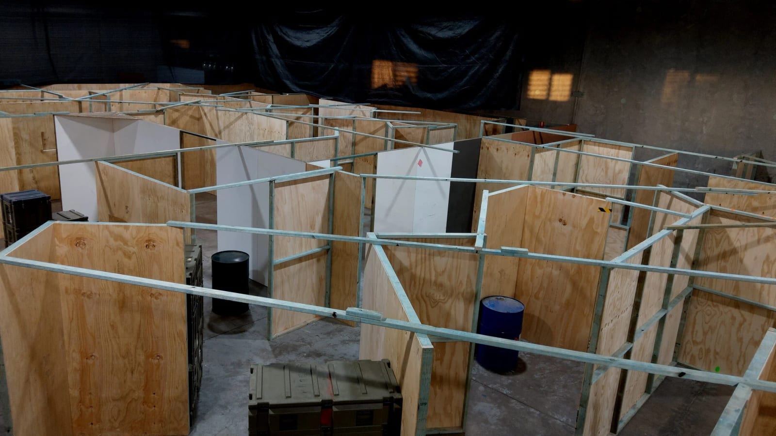The indoor CQB maze at Urban Gel Ball, a plywood-walled close-quarters arena